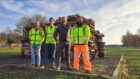 For men standing in front of pile of pallets ahead of Perth bonfire