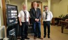 Councillor Steven Carr and John and Craig McNicoll in front of the counter at the Auchterarder banking hub.