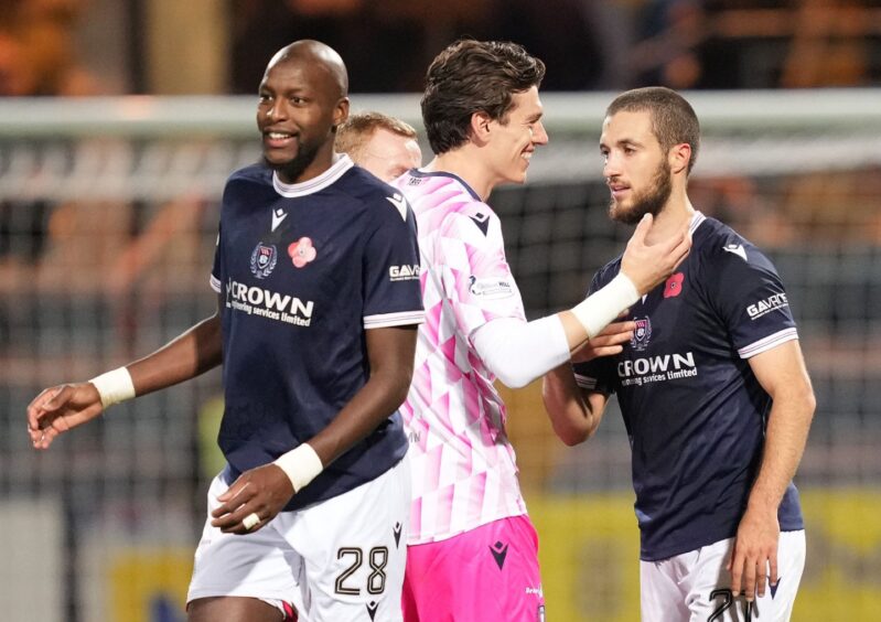 Jon McCracken thanks Ziyad Larkeche at full-time. Image: Mark Runnacles/Shutterstock