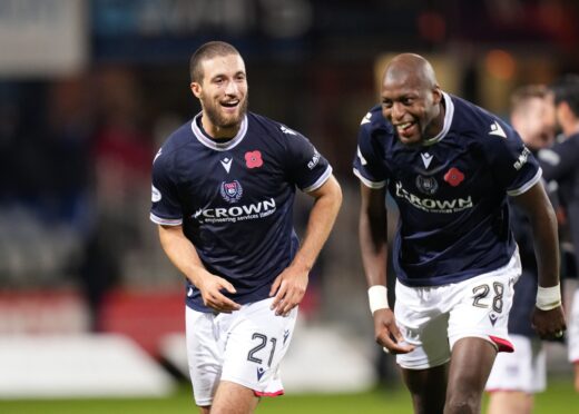 Dundee goalscorer Ziyad Larkeche jokes with compatriot Mo Sylla after Dundee beat Kilmarnock. Image: Mark Runnacles/Shutterstock