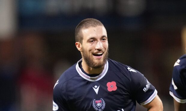 Dundee goalscorer Ziyad Larkeche jokes with compatriot Mo Sylla after Dundee beat Kilmarnock. Image: Mark Runnacles/Shutterstock