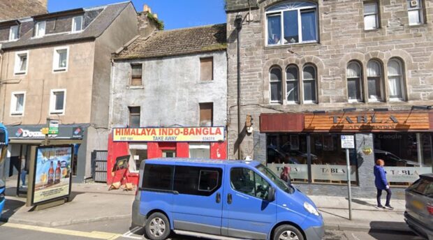 View of Himalaya restaurant with run down two storeys above