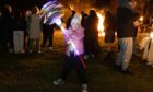 Emily Swankie, 7, with her glow wand at Kirriemuir Hill. Image: Paul Reid