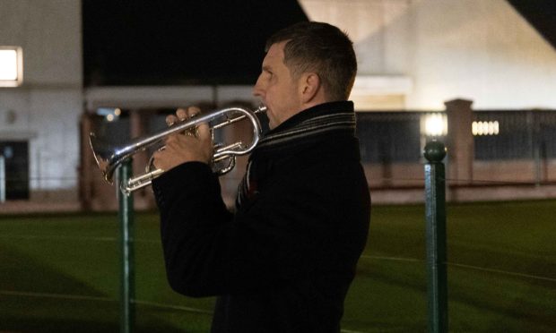 Convicted sex offender Dean Bromage playing the Last Post at the Carnoustie Remembrance event.