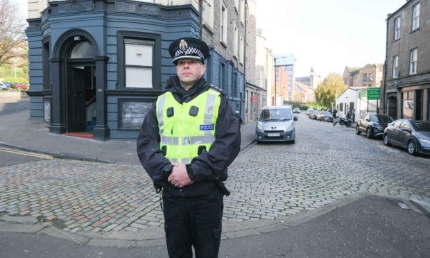 Chief Inspector Colin Echevarria near the Town House pub on the corner of Cowgate - yards from where the rape happened. Image: Paul Reid