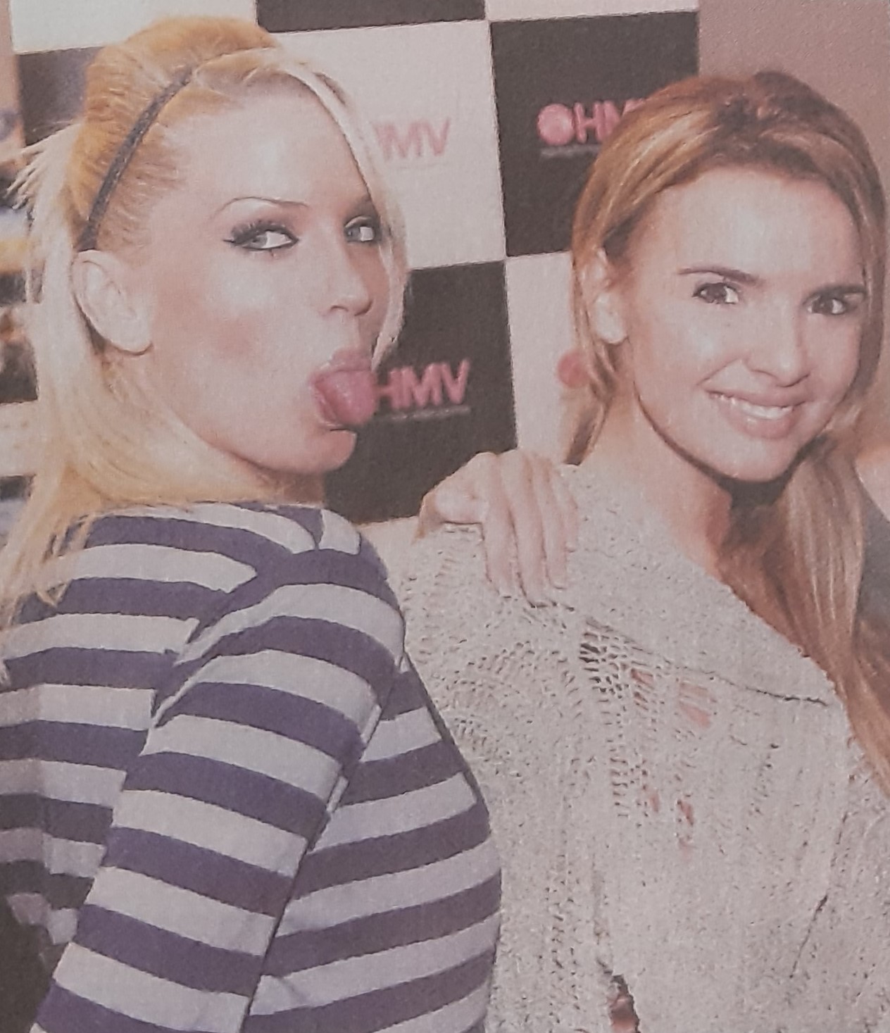 Sarah Harding, standing beside Nadine Coyle, sticks her tongue out in a a cheeky pose for our photographer at the Mercat Shopping Centre in 2005.