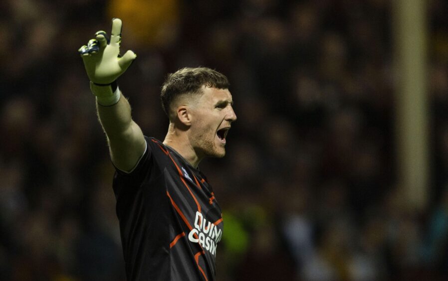 Dundee United goalkeeper Jack Walton makes his voice heard