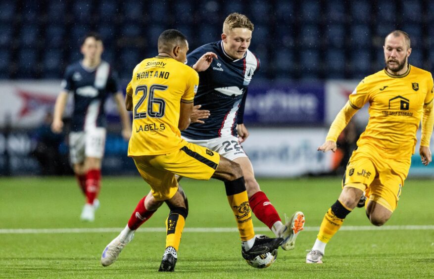 Luke Graham takes the game to Livingston. Image: Ross Parker/SNS