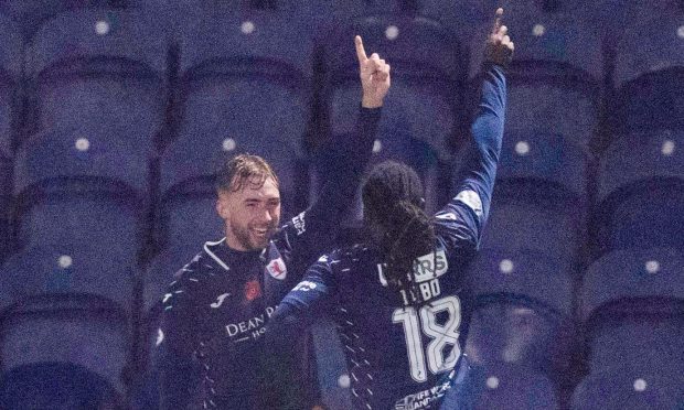 Raith Rovers duo Lewis Jamieson and Fankaty Dabo point into the air in celebration.