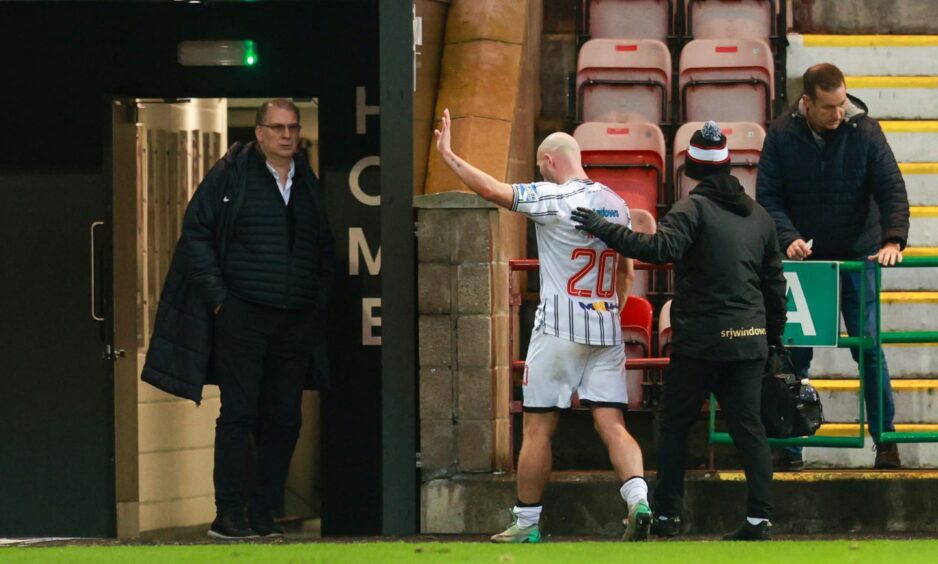 Pars striker Chris Kane is helped down the tunnel after having to be substituted against Partick Thistle.