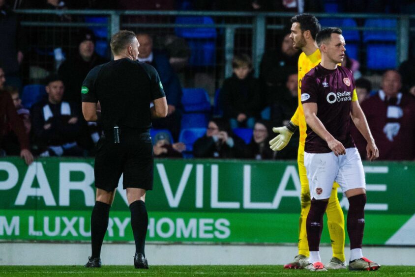 Craig Gordon remonstrates with referee, Chris Graham, after a St Johnstone penalty is awarded. 