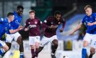 Beni Baningime bursts through before setting up Hearts' winning goal.