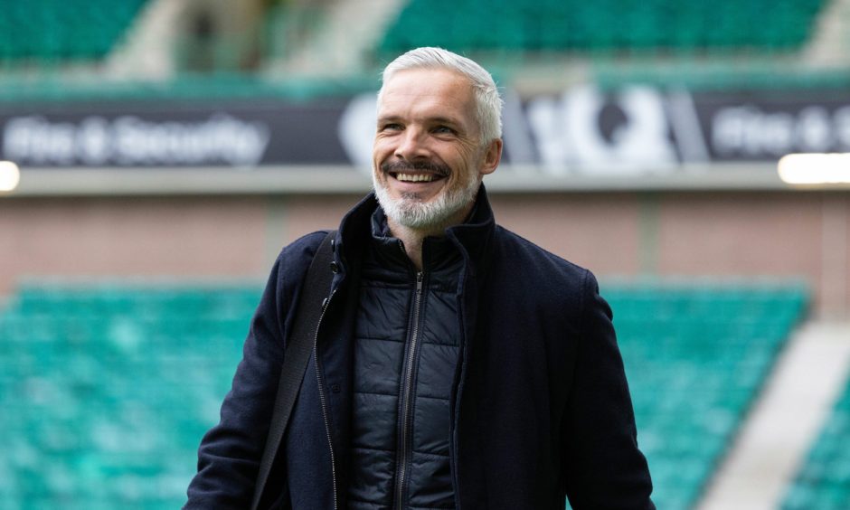 Jim Goodwin was all smiles as he arrived at Easter Road on Sunday.