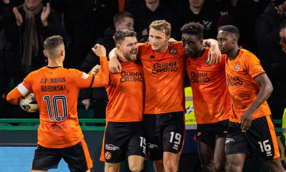 The Dundee United players celebrate Sam Dalby's finish