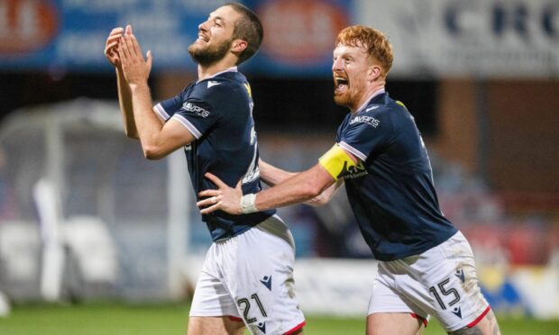 Ziyad Larkeche and Simon Murray celebrate the winner. Image: Paul Devlin/SNS