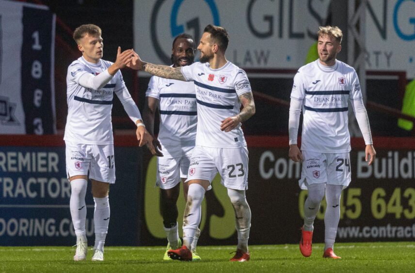 Dylan Easton celebrates with Lewis Gibson, Fankaty Dabo and Lewis Jamieson following his equaliser in the 1-1 draw with Partick Thistle.