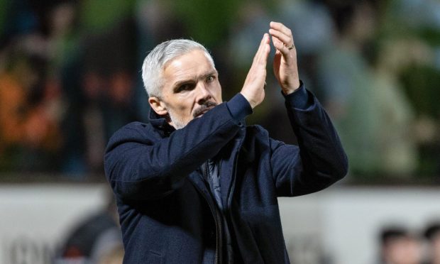 Jim Goodwin applauds the Dundee United faithful.