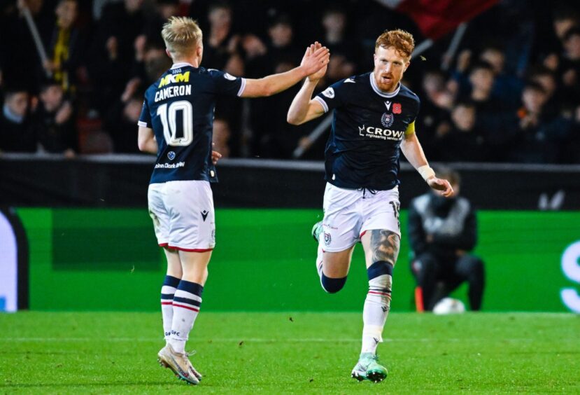 Simon Murray celebrates his goal with team-mate Lyall Cameron.