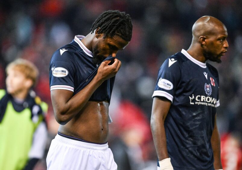 Billy Koumetio and Mo Sylla show their disappointment at Dundee's loss at Pittodrie.