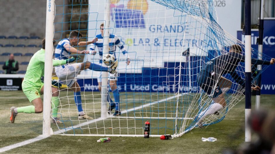 Morton defender Jack Baird hooks the ball away from goal as Jack Hamilton ends up in the net after his header.