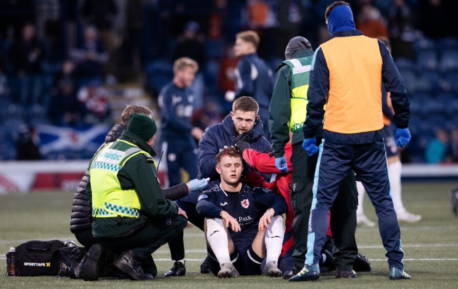 Jack Hamilton receives treatment for a nasty head wound against Morton.