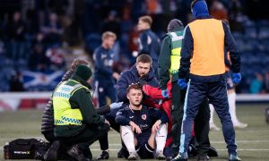 Raith Rovers striker Jack Hamilton receives treatment for a head knock against Morton.