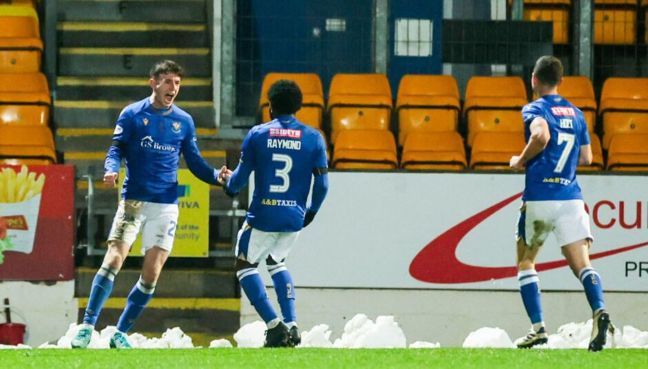 Makenzie Kirk and Andre Raymond celebrate with each other after Kirk scored against Kilmarnock.