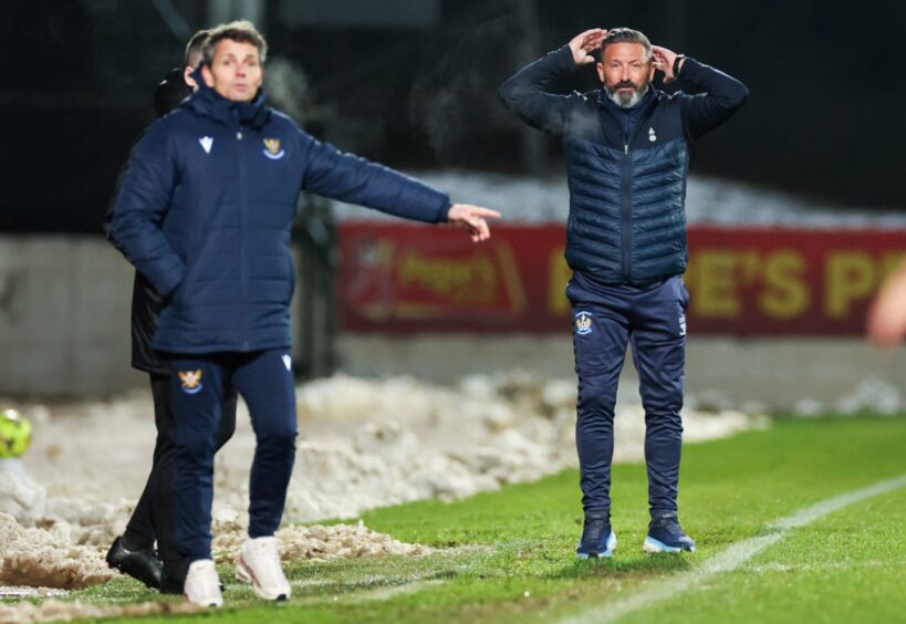 Simo Valakari and Derek McInnes watching the game from the touchline.