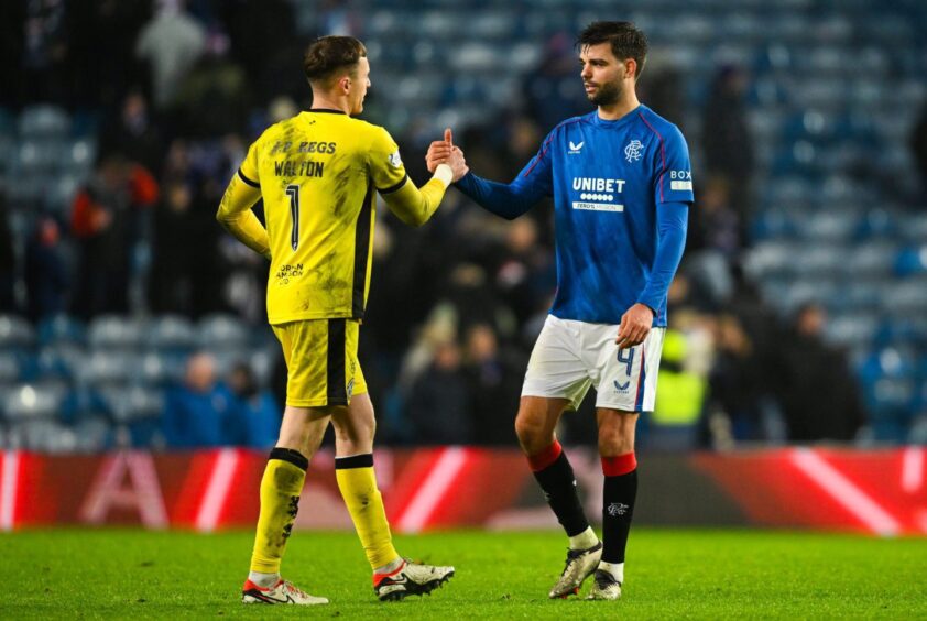 Dundee United's Jack Walton, left, and Rangers man Robin Propper