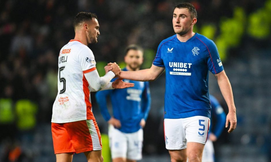 Vicko Sevelj, left, and former Dundee United defender John Souttar