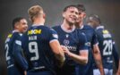 Jordan McGhee celebrates with Curtis Main after the striker made it 4-1 to Dundee against Hibs. Image: Euan Cherry/SNS