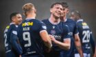 Jordan McGhee celebrates with Curtis Main after the striker made it 4-1 to Dundee against Hibs. Image: Euan Cherry/SNS