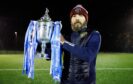 Dundee North End co-manager Kevin McNaughton holds the Scottish Cup. Image: Ross Parker/SNS