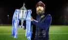 Dundee North End co-manager Kevin McNaughton holds the Scottish Cup. Image: Ross Parker/SNS