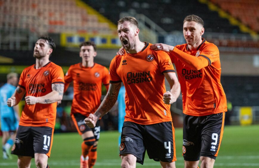 The Dundee United players celebrate.