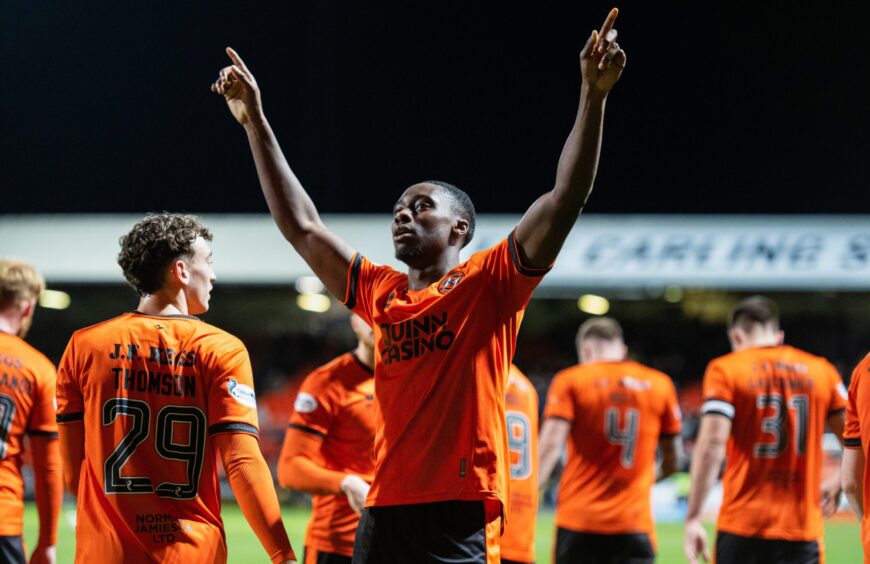 Manny Adegboyega takes the acclaim of the United faithful.