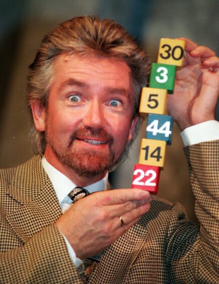 Noel Edmonds with the first six National Lottery numbers in 1994.