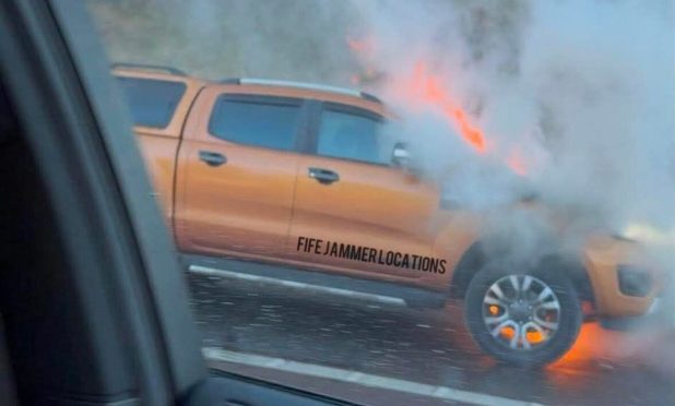 Car on fire on the M90.