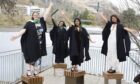 Friends gathered together to celebrate their academic achievements, posing for photos in front of the loch. Images: University of Stirling