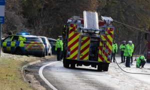 Police and firefighters at the scene of the A9 crash near Ballinluig. Image: Marieke McBean