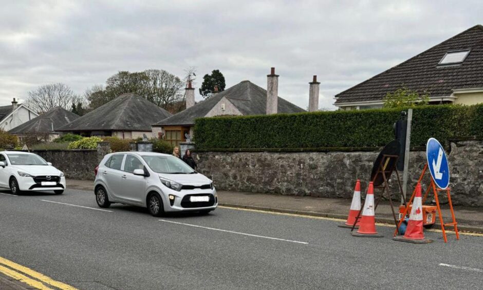 Cars were previously ignoring the "wait here" sign.