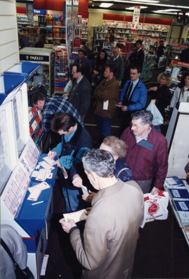 Queuing for National Lottery tickets in John Menzies.