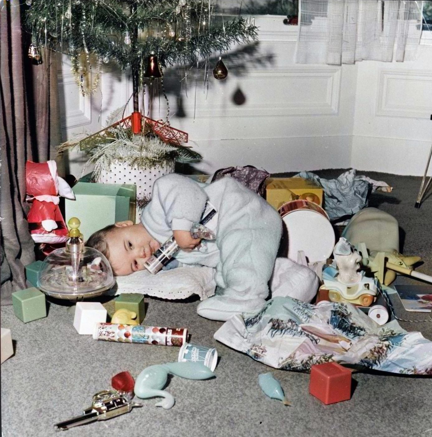 Eighteen-month-old Craig Shearer from Dundee under the tree and among his presents in 1971.