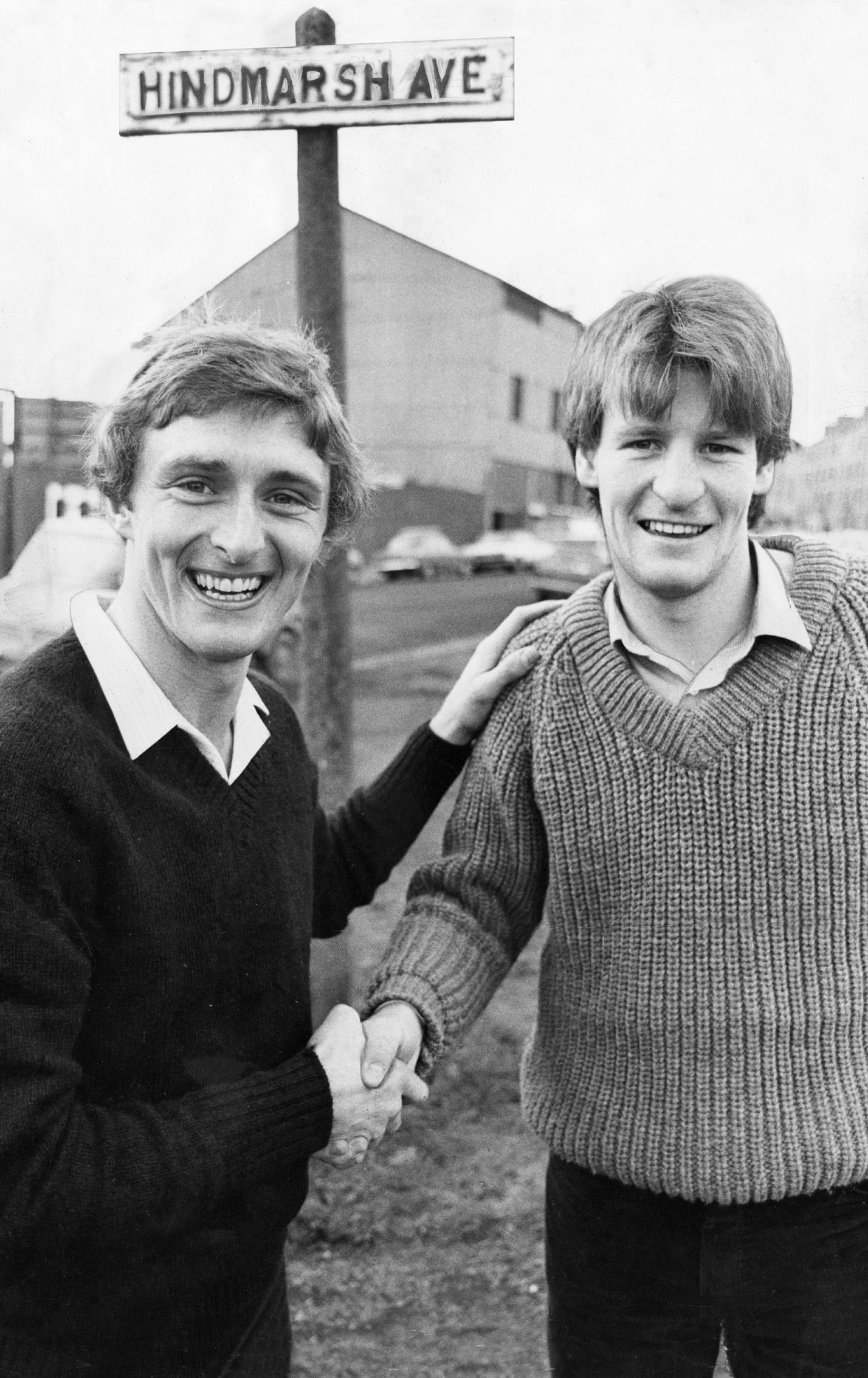 Paul Hegarty and Dundee FC captain Bobby Glennie shake hands as they meet up in a Dundee street before the match.