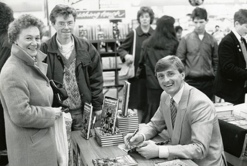 Hegarty chatting to supporters while signing copies of his book in 1987.