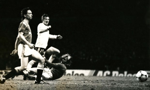 Paul Sturrock scores the equaliser for Dundee United at Old Trafford, as the Manchester United goalie dives and a Red Devils defender looks on.