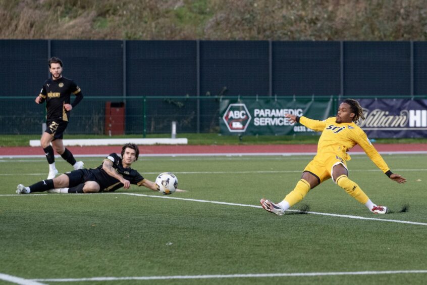 Dapo Mebude slides in to score Dunfermline Athletic's opening goal against Edinburgh City.