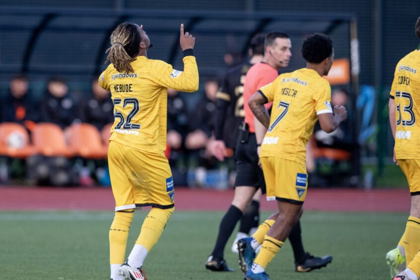 Dapo Mebude points to the sky as he celebrates scoring his first goal for Dunfermline Athletic.