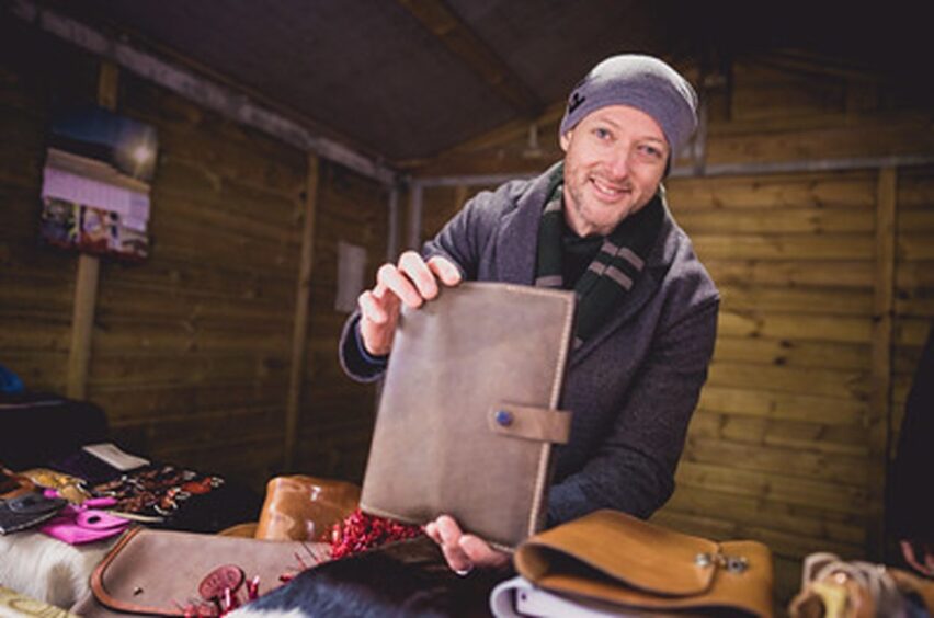 Artist displaying work at the Cabin Trail.