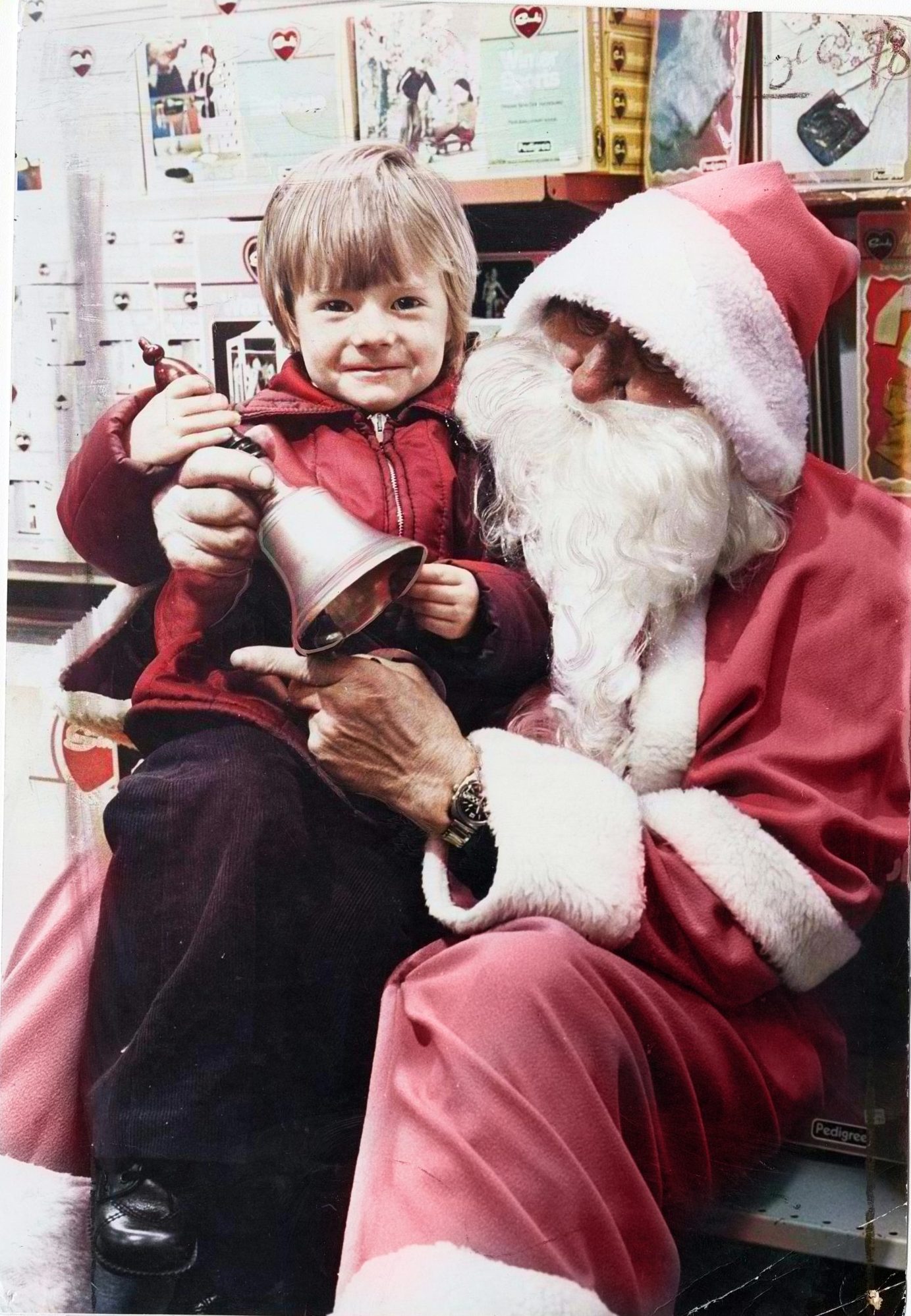 a young boy sitting on Santa's knee in John Menzies in 1978. 